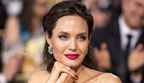 Angelina Jolie poses nude on Harpers Bazaar cover